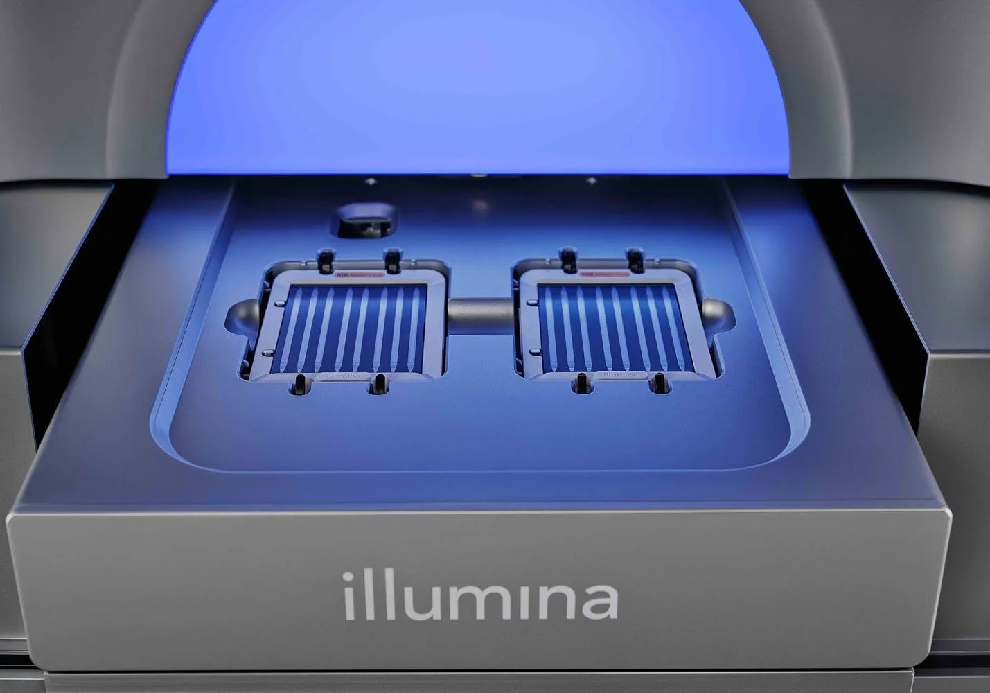 An Illumina genome sequencer with its two flow-cell bays lit blue
